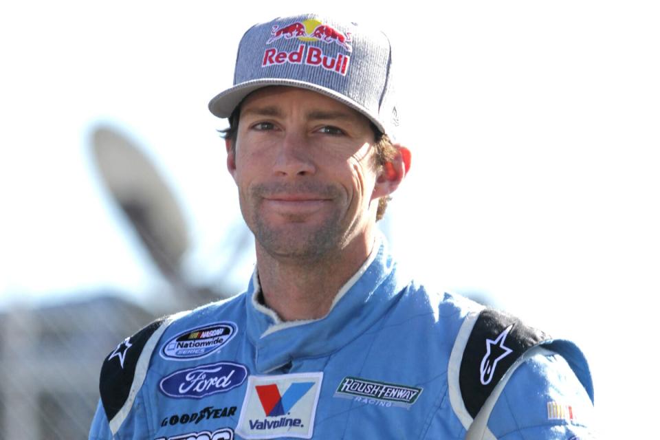 Travis Pastrana, driver of the #60 Roush Fenway Racing Ford, looks on during practice for the NASCAR Nationwide Series ServiceMaster 200