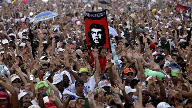 In this file photo, a person holds a banner of Che Guevara at the Peace Without Borders concert in Revolution Square in Havana, Cuba on Sept. 20, 2009. - Photo: Javier Galeano (AP)