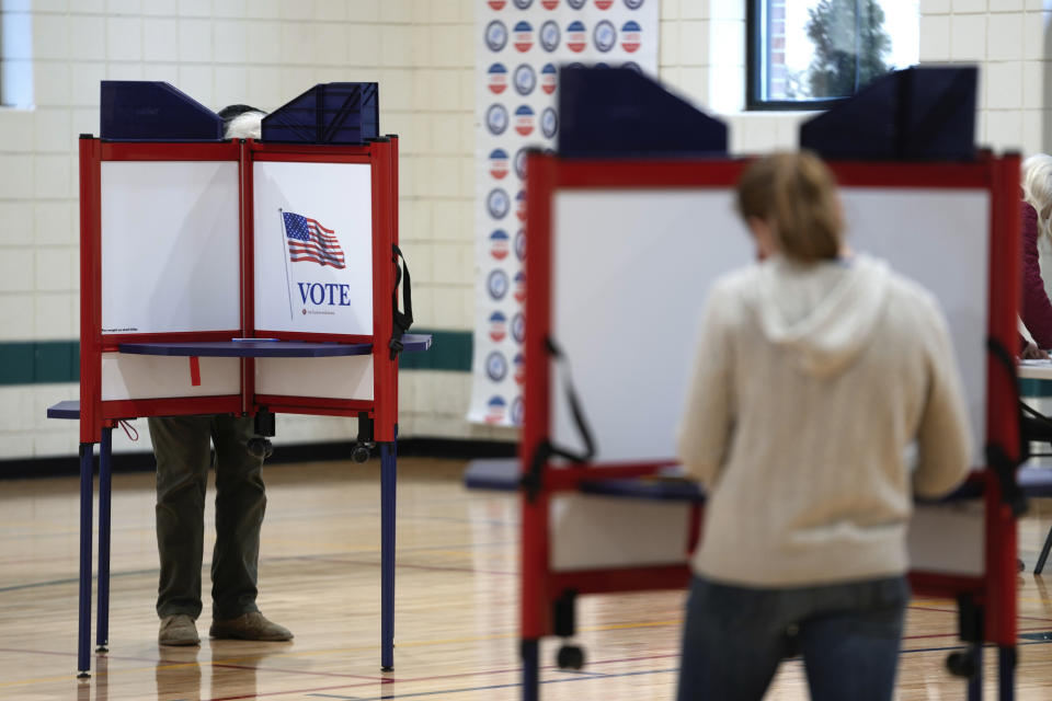 Voters fill out their ballots for the Michigan primary election in Grosse Pointe Park, Mich., Tuesday, Feb. 27, 2024. Michigan is the last major primary state before Super Tuesday and a critical swing state in November's general election. (AP Photo/Paul Sancya)