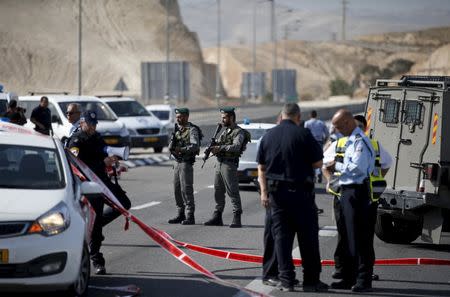 Israeli paramilitary police officers stand guard at the scene of what police said was an attempted ramming attack near the West Bank Jewish settlement of Kfar Adumim November 22, 2015. REUTERS/Ronen Zvulun