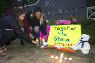 <p>(L-R) Ariel Pantoja, 19, Bayley Morrow, 18 and Makayla Bentley, 18, light candles at a makeshift memorial outside the Cascade Mall on September 24, 2016 in Burlington, Washington. Around 20 people gathered to honor the five victims who were killed in a shooting at the Cascade Mall in Burlington yesterday. It has been reported that the gunman has been taken into custody. (Karen Ducey/Getty Images) </p>