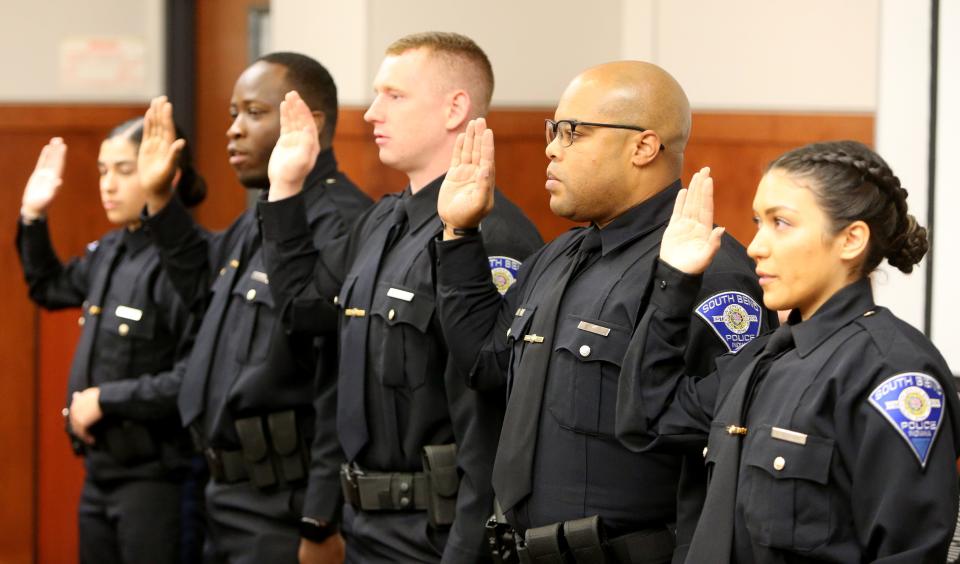 The five newest South Bend Police Department probationary officers take their oath Wednesday, Aug. 30, 2023, in the South Bend Police Department auditorium. They were sworn by the Board of Public Safety. From left are Kassandra Duran, Andre Mathews, Robert Neufer, Quentin Phillips and Faith Quintana.