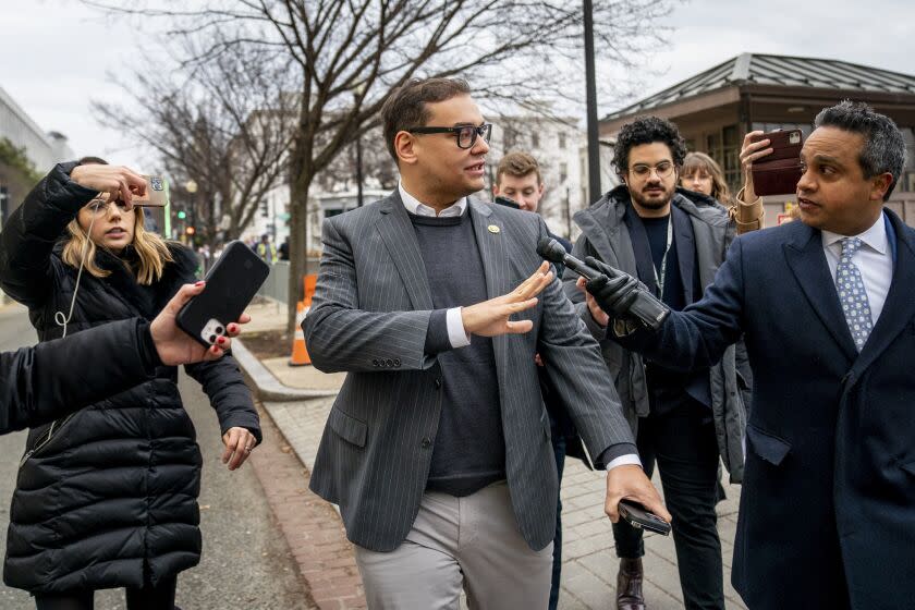 Rep. George Santos, R-N.Y., leaves a House GOP conference meeting on Capitol Hill in Washington, Wednesday, Jan. 25, 2023. (AP Photo/Andrew Harnik)