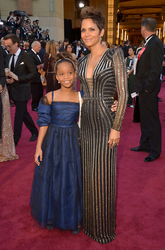 Quvenzhane Wallis and Halle Berry arrive at the Oscars in Hollywood, California, on February 24, 2013.
