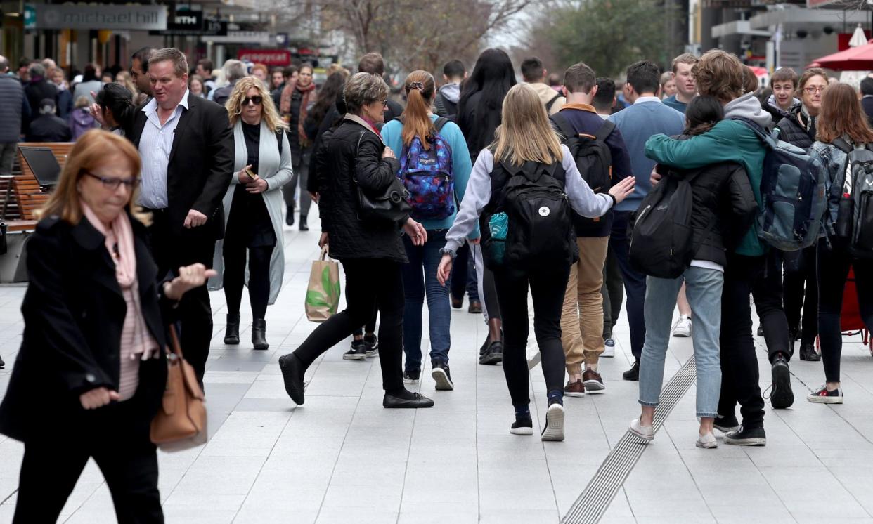 <span>Pedestrians in Rundle Mall in Adelaide. The federal government has announced migration-cutting policies including English language requirements and a ‘genuine student’ test.</span><span>Photograph: Kelly Barnes/AAP</span>