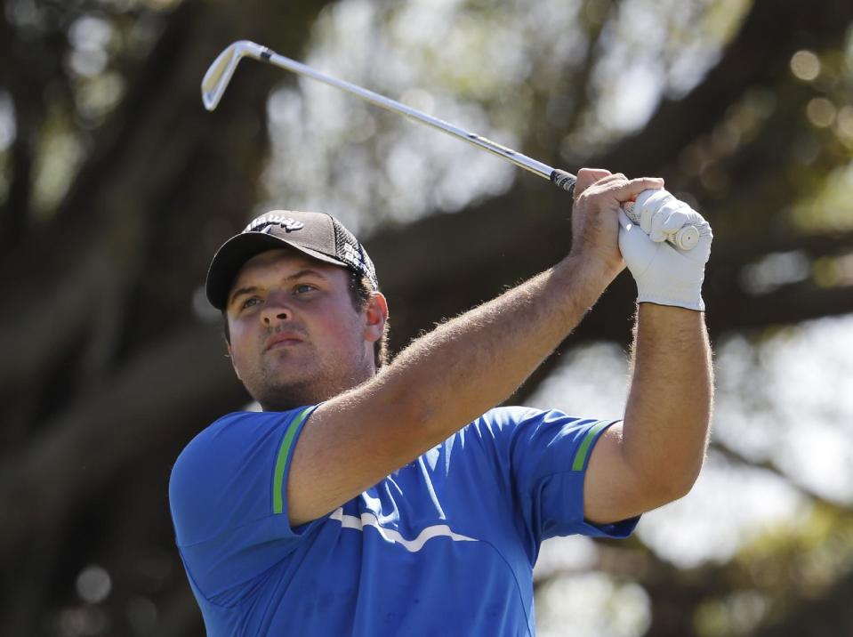 Patrick Reed hits from the fifth tee during the third round of the Cadillac Championship golf tournament on Saturday, March 8, 2014, in Doral, Fla. (AP Photo/Lynne Sladky)