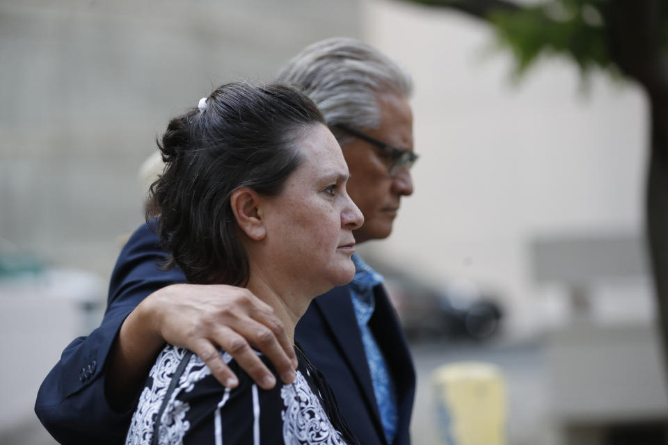 Former deputy prosecutor Katherine Kealoha, left, and husband, former Honolulu police chief Louis Kealoha, walk toward Queen Street after the verdict in their corruption case at federal court Thursday, June 27, 2019, in Honolulu. A jury has found the Kealohas guilty in a plot to frame a relative to silence him from revealing fraud that financed their lavish lifestyle, a case that shook the top levels of law enforcement. The jury found both Kealohas guilty of conspiracy. (Cindy Ellen Russell/Honolulu Star-Advertiser via AP)