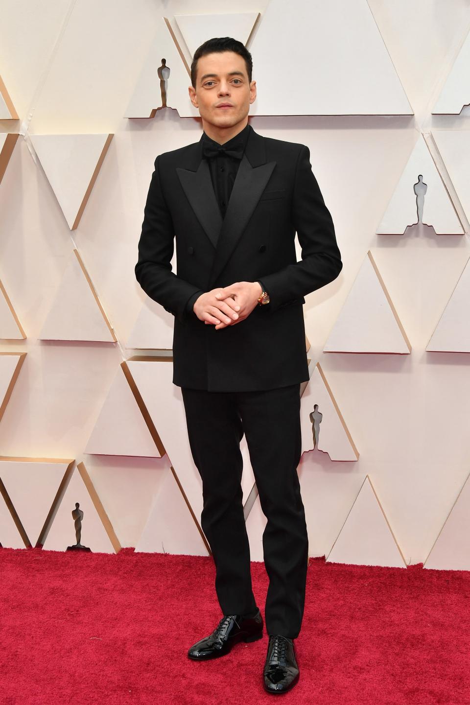 Rami Malek in Saint Laurent and a Cartier watch