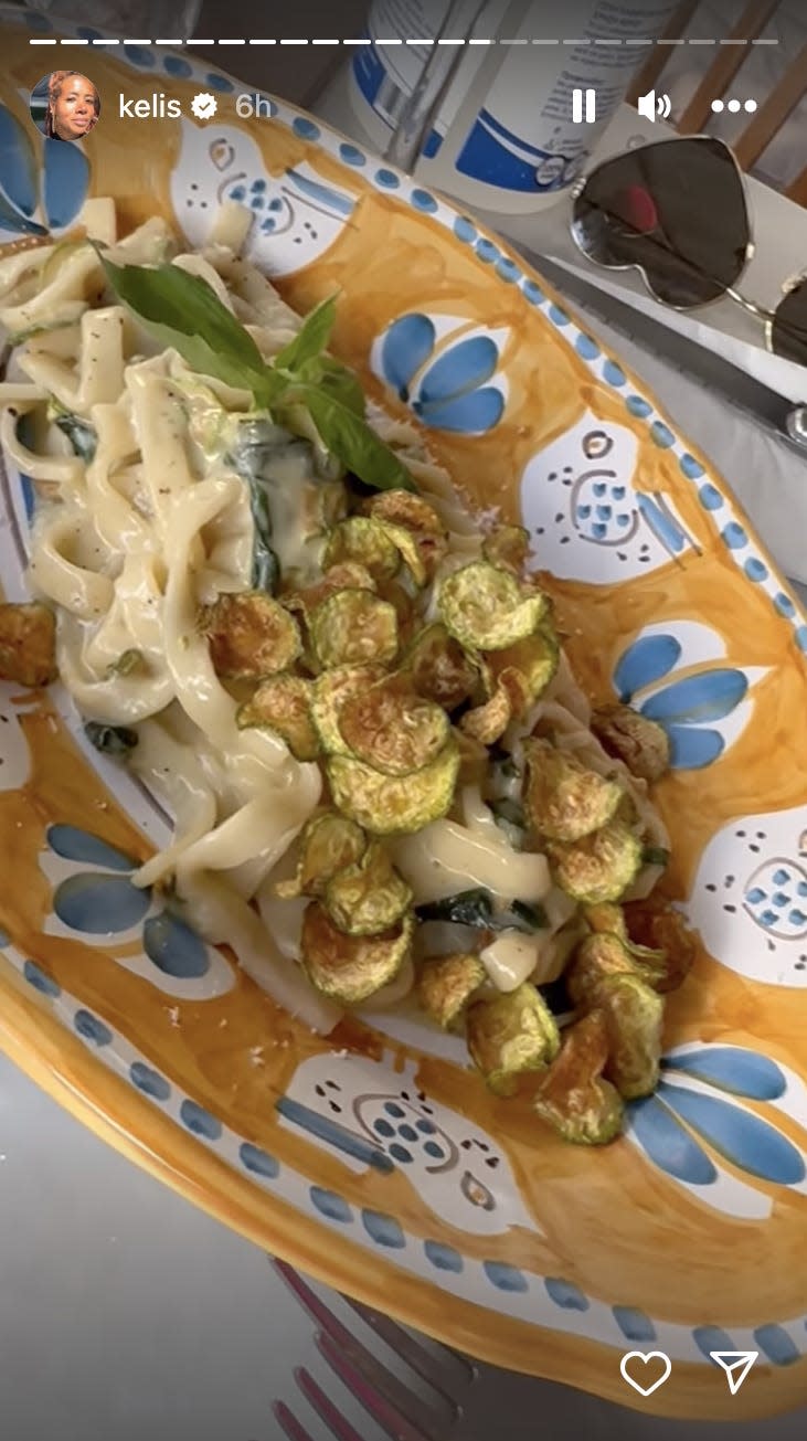 A picture of a pasta dish in an orange bowl