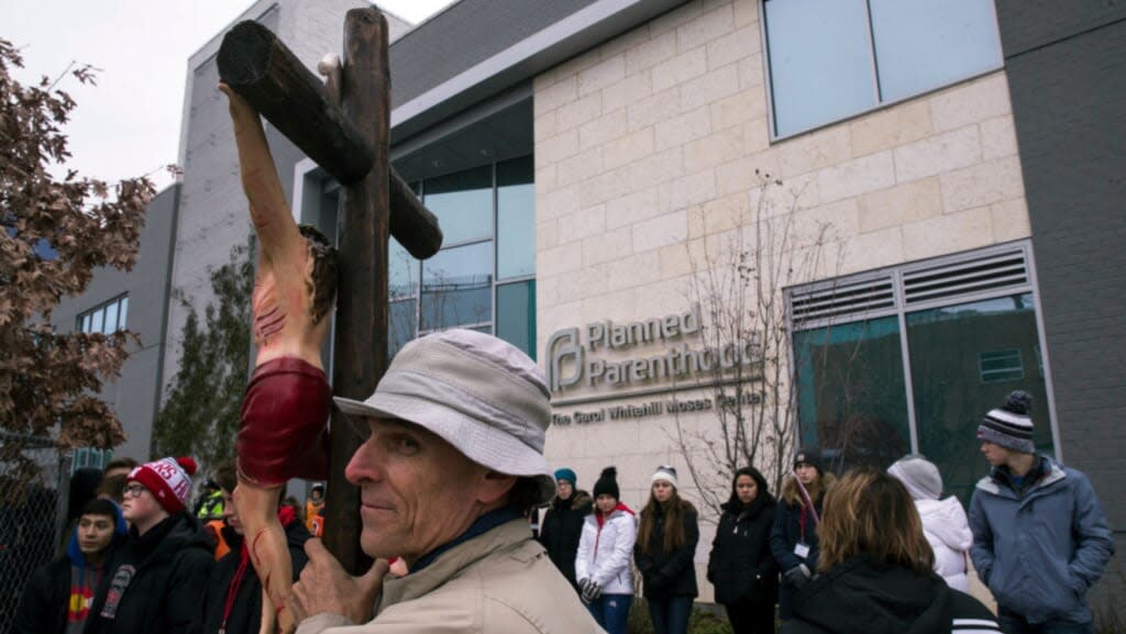 Richard Mahoney of the Pro-Life Shrine of the Immaculate Conception and American Holocaust Museum holds a crucifix during a protest vigil sponsored by The Christian Defense Coalition and Priests for Life outside of the Planned Parenthood of Metropolitan Washington, D.C., Carol Whitehill Moses Center on January 17, 2019 in Washington, DC. (Photo by Zach Gibson/Getty Images)