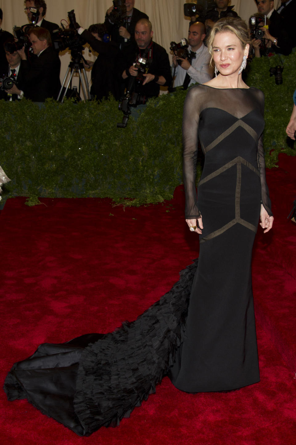 Renee Zellweger arrives at the Metropolitan Museum of Art Costume Institute gala benefit, celebrating Elsa Schiaparelli and Miuccia Prada, Monday, May 7, 2012 in New York. (AP Photo/Charles Sykes)