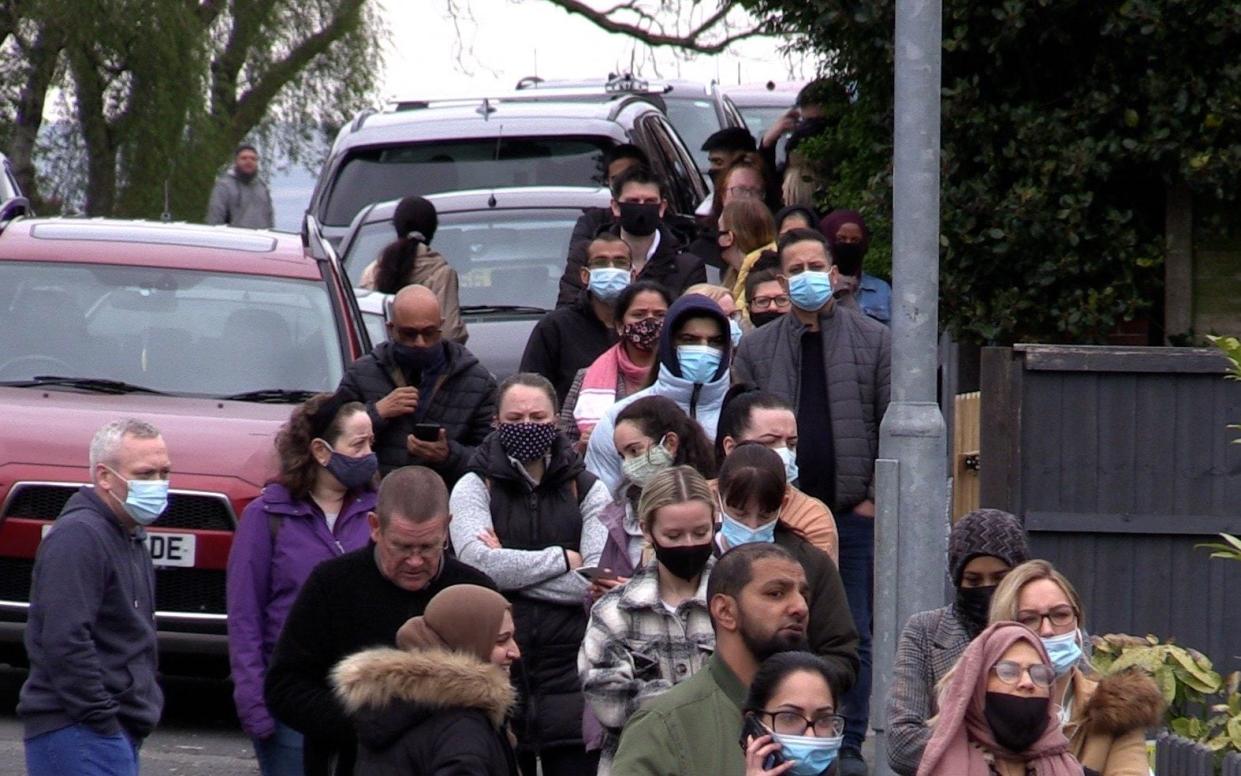 People queue at a vaccination centre at the Essa Academy in Bolton. The Indian Covid variant has been detected in a number of areas including Bolton, which are reporting the highest rates of infection, data suggests - PA