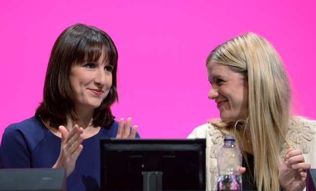 Rachel and Ellie Reeves (left) sit and clap