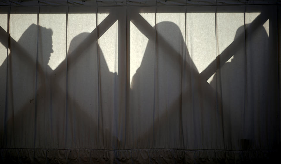 FILE - In this Sunday, April 1, 2018 file photo, nuns are silhouetted in St. Peter's Square at the Vatican. Some nuns are now finding their voices, buoyed by the #MeToo movement and the growing recognition that adults can be victims of sexual abuse when there is an imbalance of power in a relationship. The sisters are going public in part because of years of inaction by church leaders, even after major studies on the problem in Africa were reported to the Vatican in the 1990s. (AP Photo/Andrew Medichini, File)