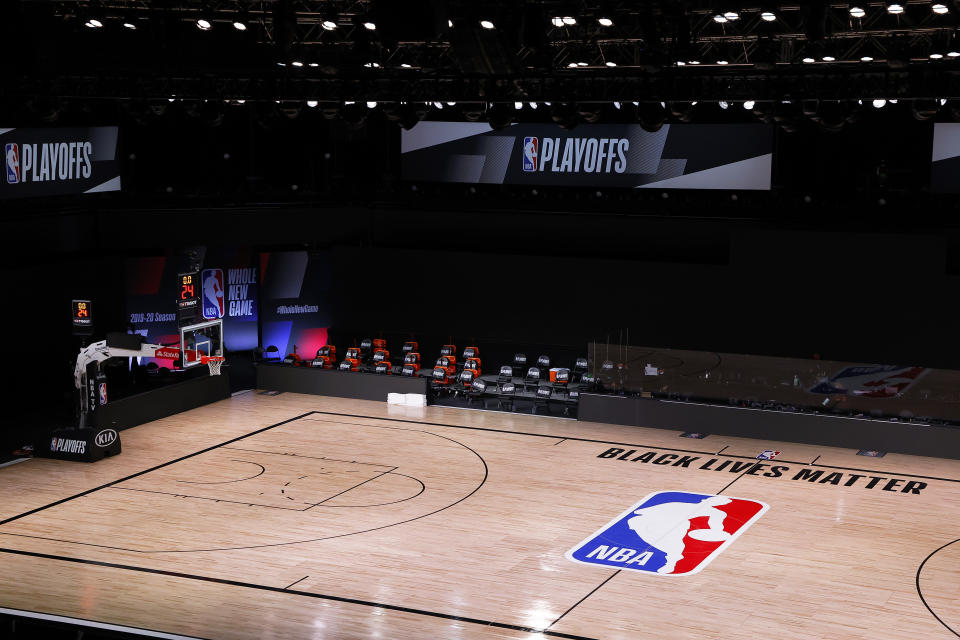 LAKE BUENA VISTA, FLORIDA - AUGUST 26: An empty court and bench is shown with no signage following the scheduled start time in Game Five of the Eastern Conference First Round between the Milwaukee Bucks and the Orlando Magic during the 2020 NBA Playoffs at AdventHealth Arena at ESPN Wide World Of Sports Complex on August 26, 2020 in Lake Buena Vista, Florida. The Milwaukee Buck have boycotted game 5 reportedly to protest the shooting of Jacob Blake in Kenosha, Wisconsin. NOTE TO USER: User expressly acknowledges and agrees that, by downloading and or using this photograph, User is consenting to the terms and conditions of the Getty Images License Agreement. (Photo by Kevin C. Cox/Getty Images)