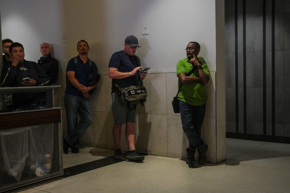 Commuters wait for updates on train availabilities at Toronto's Union Station after GO Transit and UP Express announced that  trains are not running on the entire network due to a networkwide system failure on Tuesday, Oct. 3, 2023.