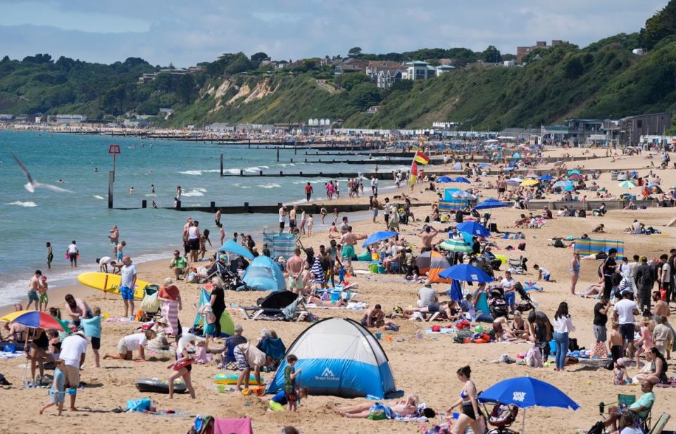 People enjoying the sunny weather on Bournemouth Beach in Dorset (Andrew Matthews/PA Wire)
