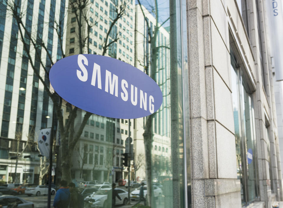 Seoul, Republic of Korea - March 26, 2013: The Samsung logo on the window of one of the South Korean company's offices in Gangnam, central Seoul, with cars and people on the street reflected  in the window.

The Samsung brand name on the external windows of one of the company's offices in central Seoul, South Korea.