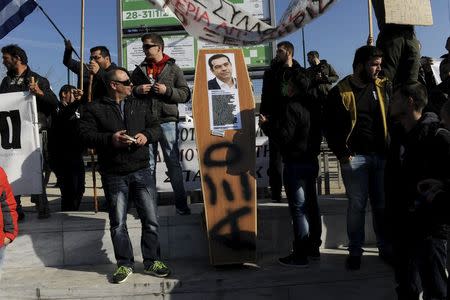 Farmers carry a mock coffin with a picture of Greek Prime Minister Alexis Tsipras during a demonstration against planned pension reforms in the northern city of Thessaloniki, Greece, January 28, 2016. REUTERS/Alexandros Avramidis