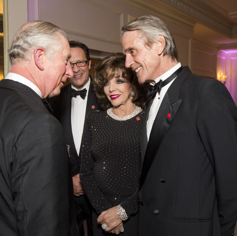 Prince Charles, Prince of Wales,  President of The Princes Trust, chats to Joan Collins and Jeremy Irons as he attends the annual Princes Invest In Futures reception at The Savoy Hotel on February 9, 2017 in London, England.  (Photo by Geoff Pugh - WPA Pool/Getty Images)