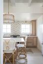 <p>"Woven lights are back in a big way and provide an unexpected pop of texture in your lighting choices. They add a warm, laid-back vibe to the kitchen are a great way to pull in natural materials to soften the look and feel of the room." — <a href="https://www.nicolashome.com/" rel="nofollow noopener" target="_blank" data-ylk="slk:Nicola Manganello, Nicola's Home;elm:context_link;itc:0;sec:content-canvas" class="link "><strong><em>Nicola Manganello, Nicola's Home </em></strong></a></p>