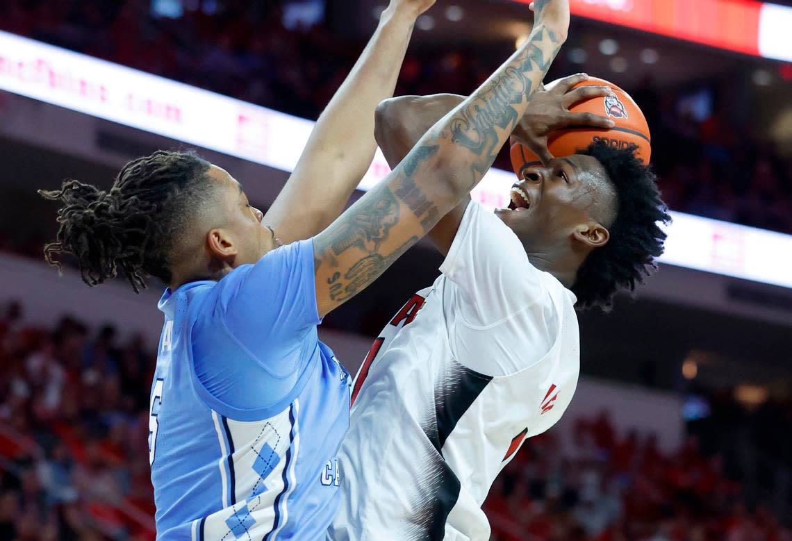 N.C. State’s Jarkel Joiner (1) heads to the basket as North Carolina’s Armando Bacot (5) defends during the second half of N.C. State’s 77-69 victory over UNC at PNC Arena in Raleigh, N.C., Sunday, Feb. 19, 2023.