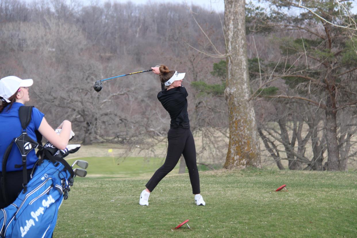 Woodward-Granger's McKenna Carroll hits the ball on Tuesday, April 12, 2022, at Perry Golf and Country Club.