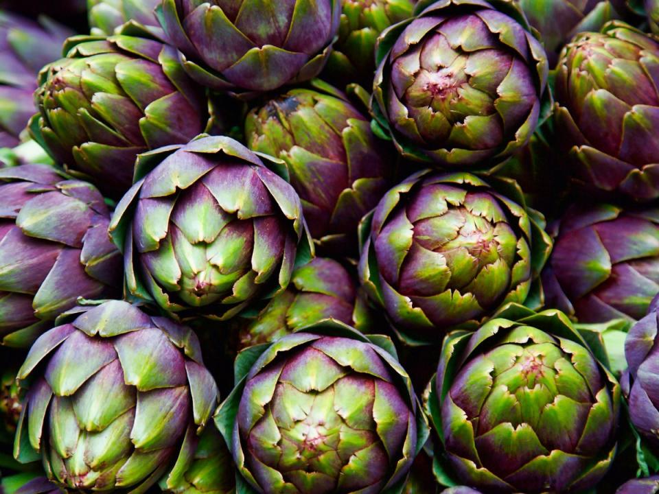 Look for firm, heavy artichokes with tightly closed leaves (Getty)