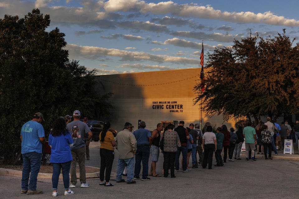 People wait in a long line outside of the SSGT Willie de Leon Civic Center to cast their ballot on Election Day, Tuesday evening, Nov. 7, 2023, in Uvalde, Texas. In Uvalde’s first mayoral race since the Robb Elementary School shooting, Cody Smith won back the job Tuesday over Kimberly Mata-Rubio, a mother who has led calls for tougher gun laws since her daughter was among the 19 children killed in the 2022 attack. (Sam Owens/The San Antonio Express-News via AP)