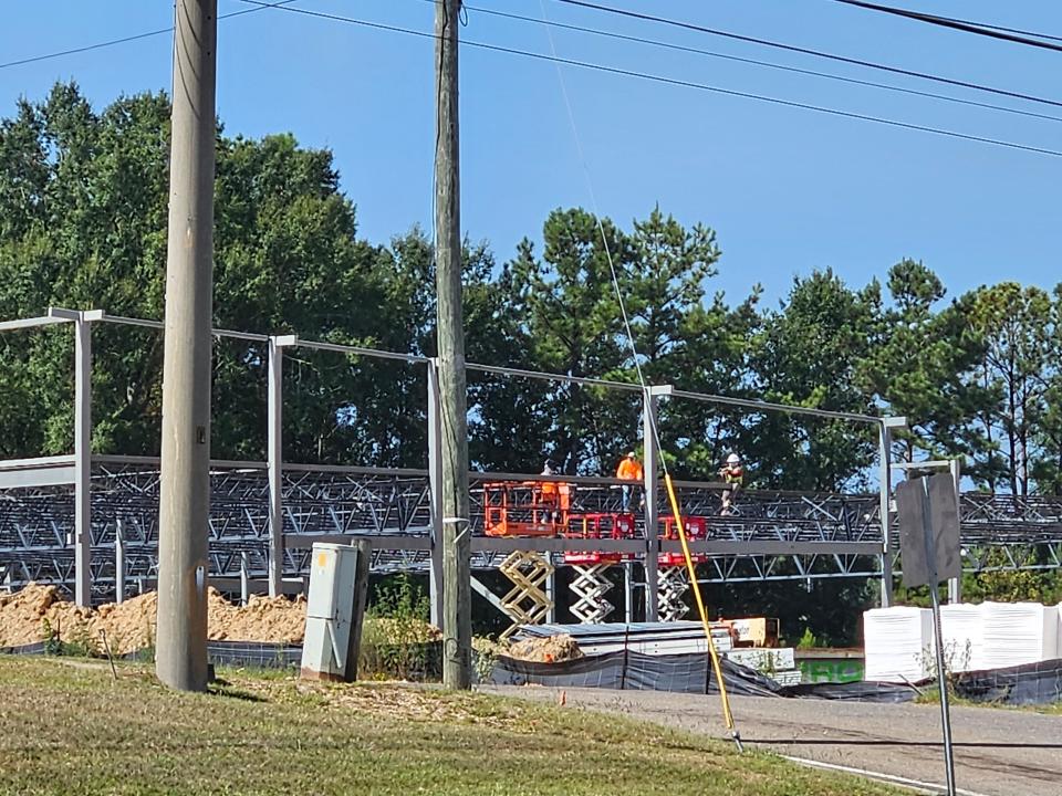 Builders work on the frame of the new ALDI store opening soon in Hattiesburg, Miss., Tuesday, Aug. 15, 2023.