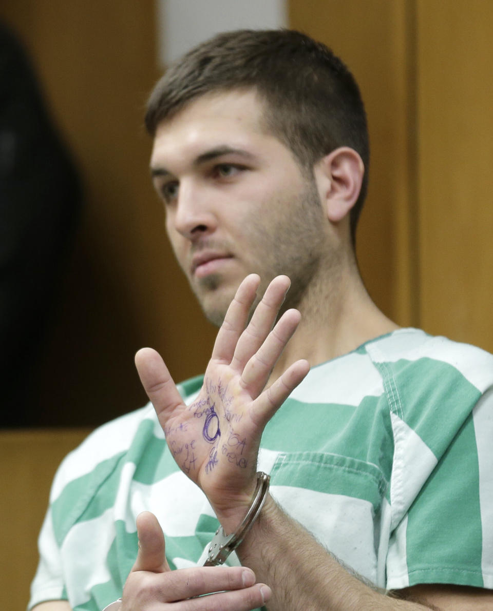 Comello displayed writing on his hand that included pro-Donald Trump slogans during his extradition hearing in Toms River, N.J., Monday, March 18, 2019. (AP Photo/Seth Wenig) (Photo: ASSOCIATED PRESS)
