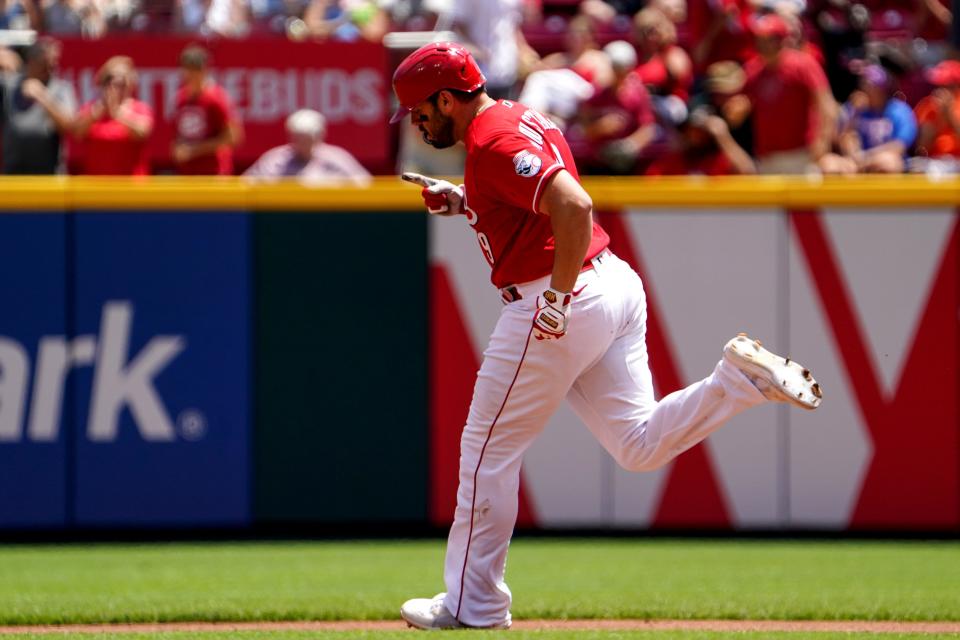 Cincinnati Reds first baseman Mike Moustakas (9) rounds the bases after hitting a three-run home during the third inning of a baseball game against the Tampa Bay Rays, Sunday, July 10, 2022, at Great American Ball Park in Cincinnati. The home run marked the 200th of his career.