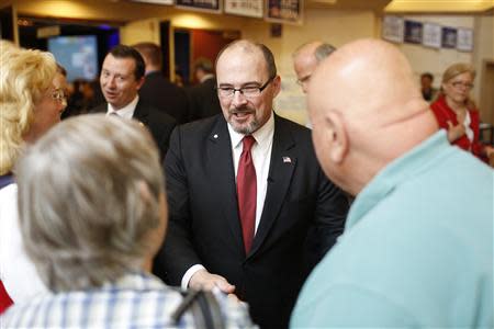 California Republican gubernatorial primary candidate Tim Donnelly (C) greets a well-wisher after delivering a speech at the California Republican Party Spring Convention in Burlingame, California March 16, 2014 REUTERS/Stephen Lam