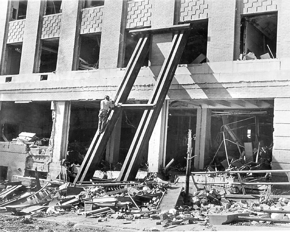 FILE - In this August, 1970, file photo investigators work at the site of a bomb explosion at the Army Mathemetics Research Center in Sterling Hall at the University of Wisconsin in Madison. Forty years after after the Aug. 24, 1970 explosion that killed one, injured others and caused millions in damage, Leo Burt remains the last fugitive wanted by the FBI in connection with radical anti-Vietnam War protest activities. (The Capital Times/Wisconsin State Journal via AP, File)