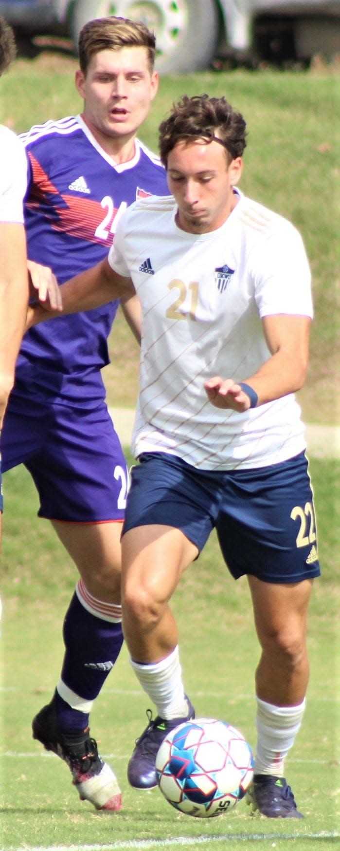 Pol Mur Llorens, right, advances the ball during Oklahoma Wesleyan University soccer action last season.