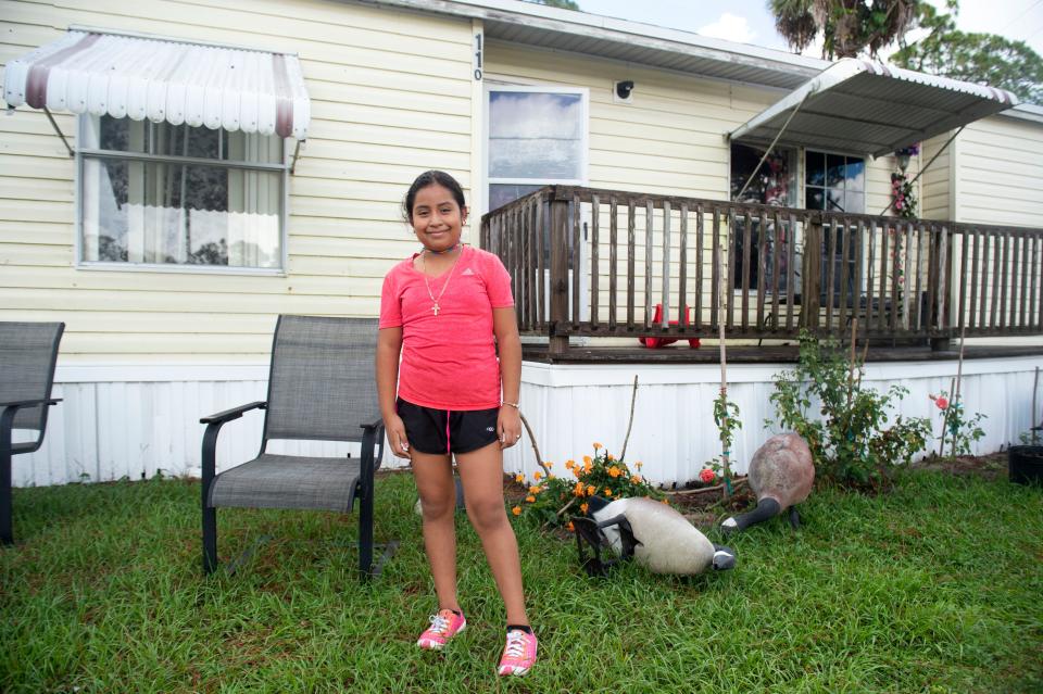 Wendy Chiroy, 9, is a student at Warfield Elementary School in Indiantown, Florida. Chiroy's parents, Jose Morales and Irma Mazariegos, were struggling with the decision of whether to send the fourth-grader back to campus as COVID-19 cases rise in Martin County. Wendy votes for going back: "I want to see my friends. I'm not really nervous."