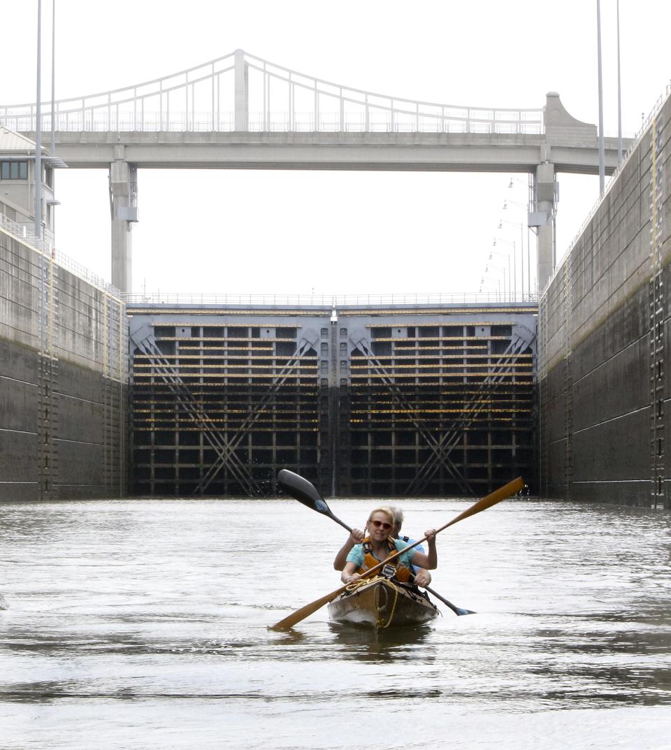 C-J Buzz columnist Kirby Adams and David Wicks paddle together out of the McAlpine Locks on the Ohio River south of downtown Louisville.
August 22, 2014