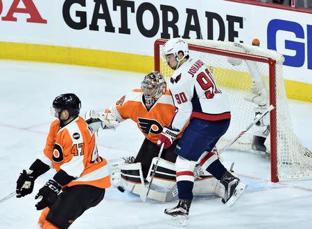 Apr 18, 2016; Philadelphia, PA, USA; Washington Capitals center Marcus Johansson (90) deflects the puck past Philadelphia Flyers goalie Steve Mason (35) during the first period in game three of the first round of the 2016 Stanley Cup Playoffs at Wells Fargo Center. Eric Hartline-USA TODAY Sports