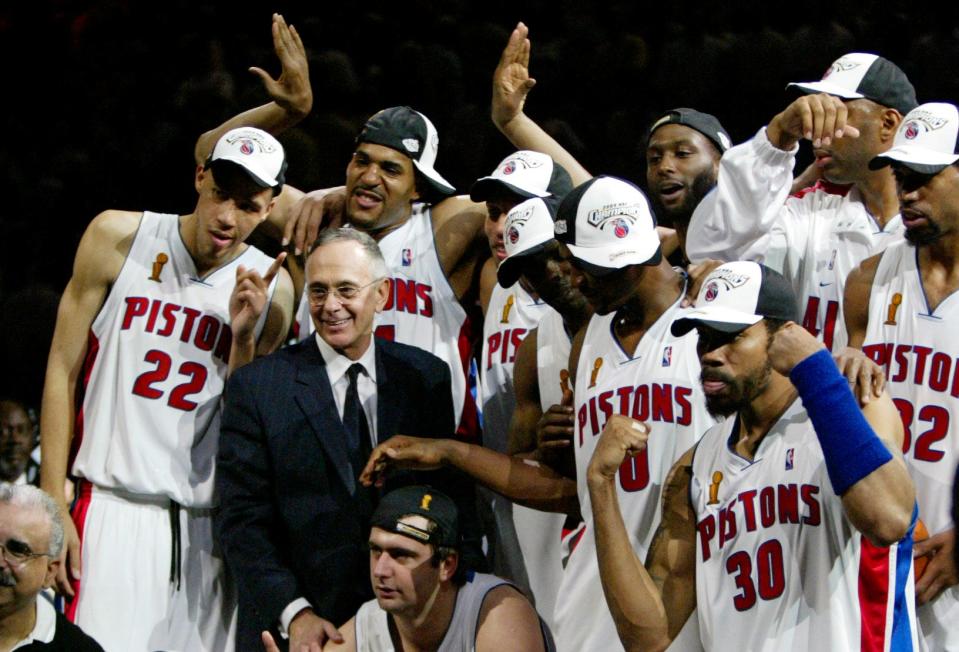 Detroit Pistons coach Larry Brown and his players celebrate the Piston 100-87 victory over the Los Angeles Lakers in  Game 5 of the NBA Finals in Auburn Hills, Mich. Tuesday night June 15, 2004.  Joining Brown are, Tayshaun Prince  (22)  Corliss Williamson, rear, and Rasheed Wallace (30) .(AP Photo/ Michael Conroy )