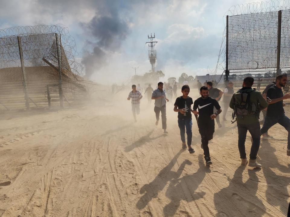 Palestinians take down the fence on the Israel-Gaza border and enter Israel after clashes and attacks in Gaza City, Gaza on October 07, 2023. / Credit: Hani Alshaer/Anadolu Agency via Getty Images