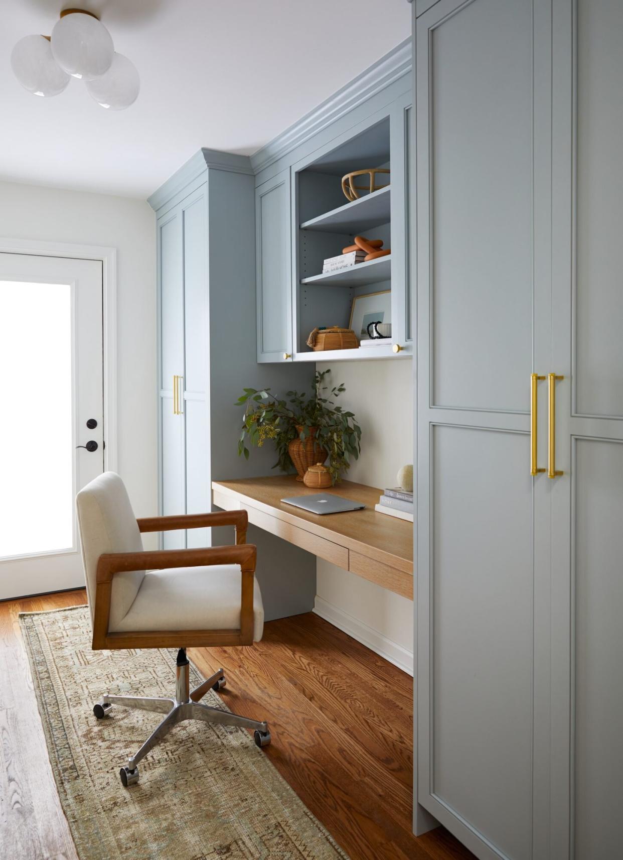 Cloffice Space of the Week, light blue paint and wooden surface in narrow home office