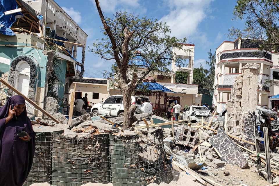 A view taken on July 13, 2019 shows the rubbles of the popular Medina hotel of Kismayo, a day after at least 26 people, including several foreigners, were killed and 56 injured in a suicide bomb and gun attack claimed by Al-Shabaab militants. - A suicide bomber rammed a vehicle loaded with explosives into the Medina hotel in the port town of Kismayo before several heavily armed gunmen forced their way inside, shooting as they went, authorities said. (Photo by STRINGER / AFP)        (Photo credit should read STRINGER/AFP/Getty Images)