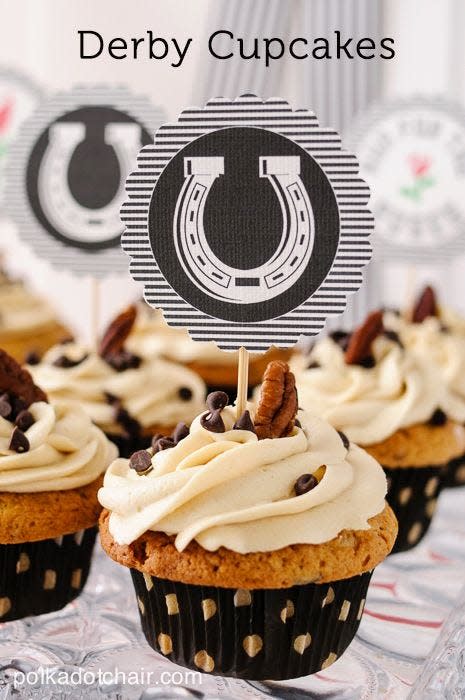 <p>Capture the flavors of Derby Pie in cupcake form by adding chopped pecans, chocolate chips, and crumbled pie crust on top.</p><p><strong>Get the recipe at <a href="http://www.polkadotchair.com/2011/05/derby-cupcakes.html/#_a5y_p=1554694" rel="nofollow noopener" target="_blank" data-ylk="slk:Polka Dot Chair;elm:context_link;itc:0;sec:content-canvas" class="link ">Polka Dot Chair</a>.</strong></p>