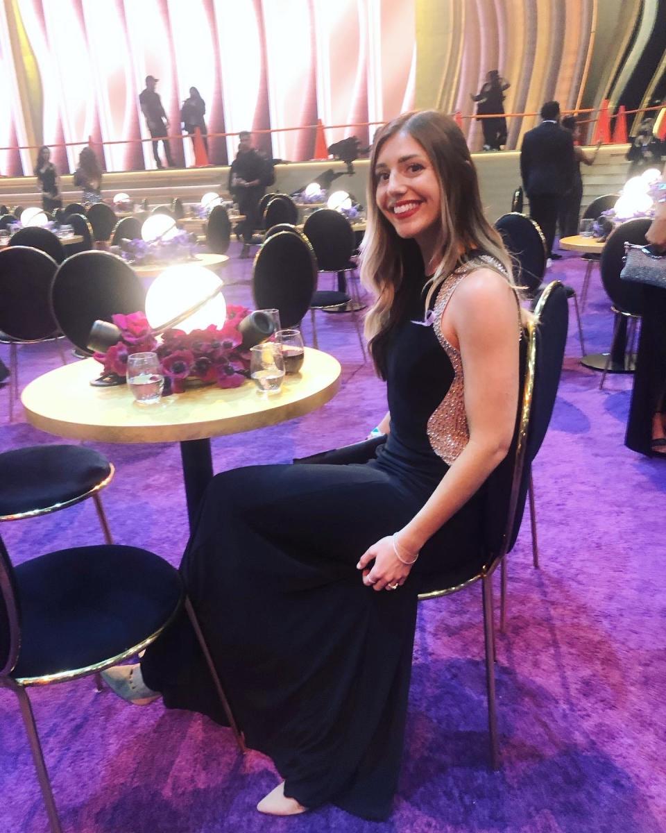 Natalie sitting at a table at the Grammys.