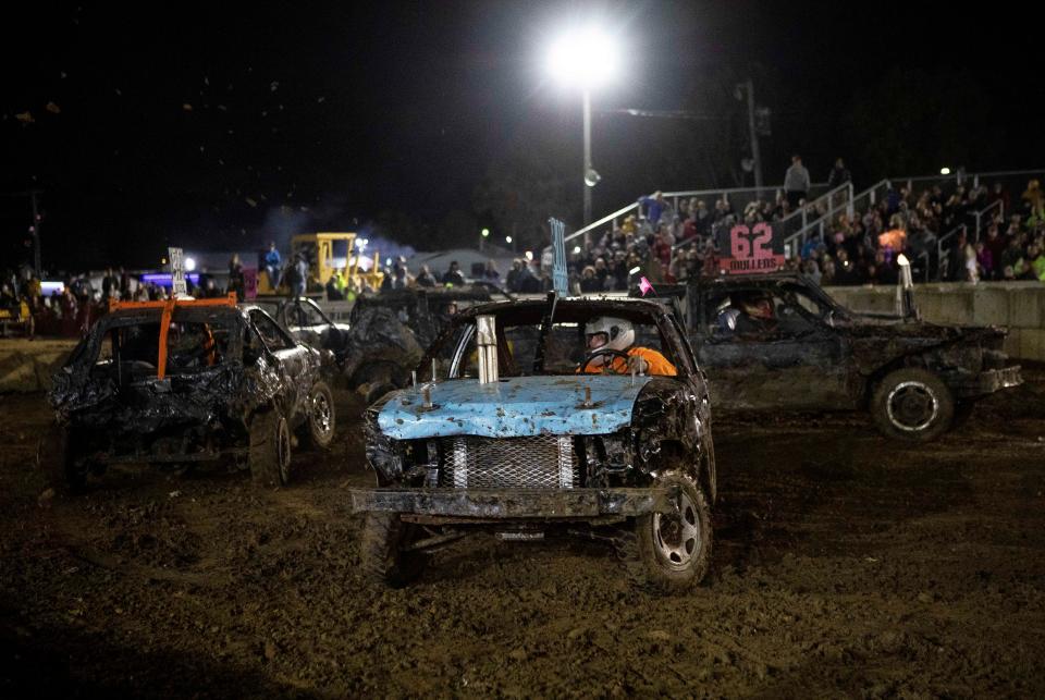 Drivers compete in the Demolition Derby in front of the grandstand at the Fairfield County Fair on Oct. 4, 2022 in Lancaster, Ohio.