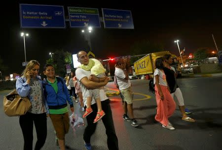 People leave Turkey's largest airport, Istanbul Ataturk, Turkey, following a blast June 28, 2016. REUTERS/Murad Sezer