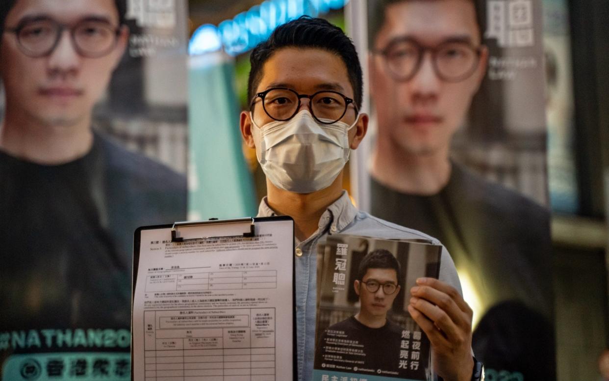 Pro-democracy activist Nathan Law, at one of his last press conferences in Hong Kong last month, says that he will fight for human rights in the former colony from his London base - Anthony Kwan/Getty Images AsiaPac