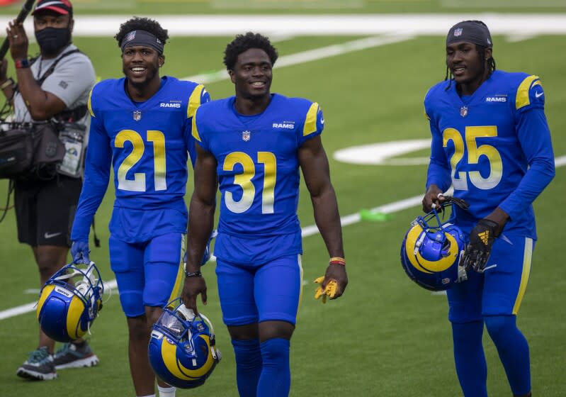 INGLEWOOD, CA - AUGUST 22: Rams Dont'e Deayon, No. 21, left, Darious Williams, No. 31, center, and David Long Jr., No. 25, right, take the field for scrimmage at SoFi Stadium Saturday, Aug. 22, 2020 in Inglewood, CA. Brian van der Brug / Los Angeles Times)