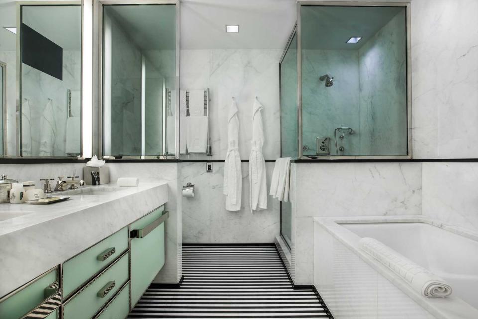 A black, white, and mint colored bathroom at The Mark, voted one of the top hotels in New York City