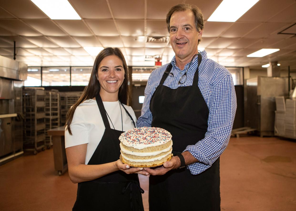 Miller Cowan (left), Ed Crenshaw, who has been baking for more than 20 years, launched an e-commerce branch of his bakery called Sugar Avenue.Ed Crenshaw and his daughter Miller Cowan pose with a cake at Sugar Avenue Bakery in Memphis, Tenn., on Wednesday, June 10, 2020.